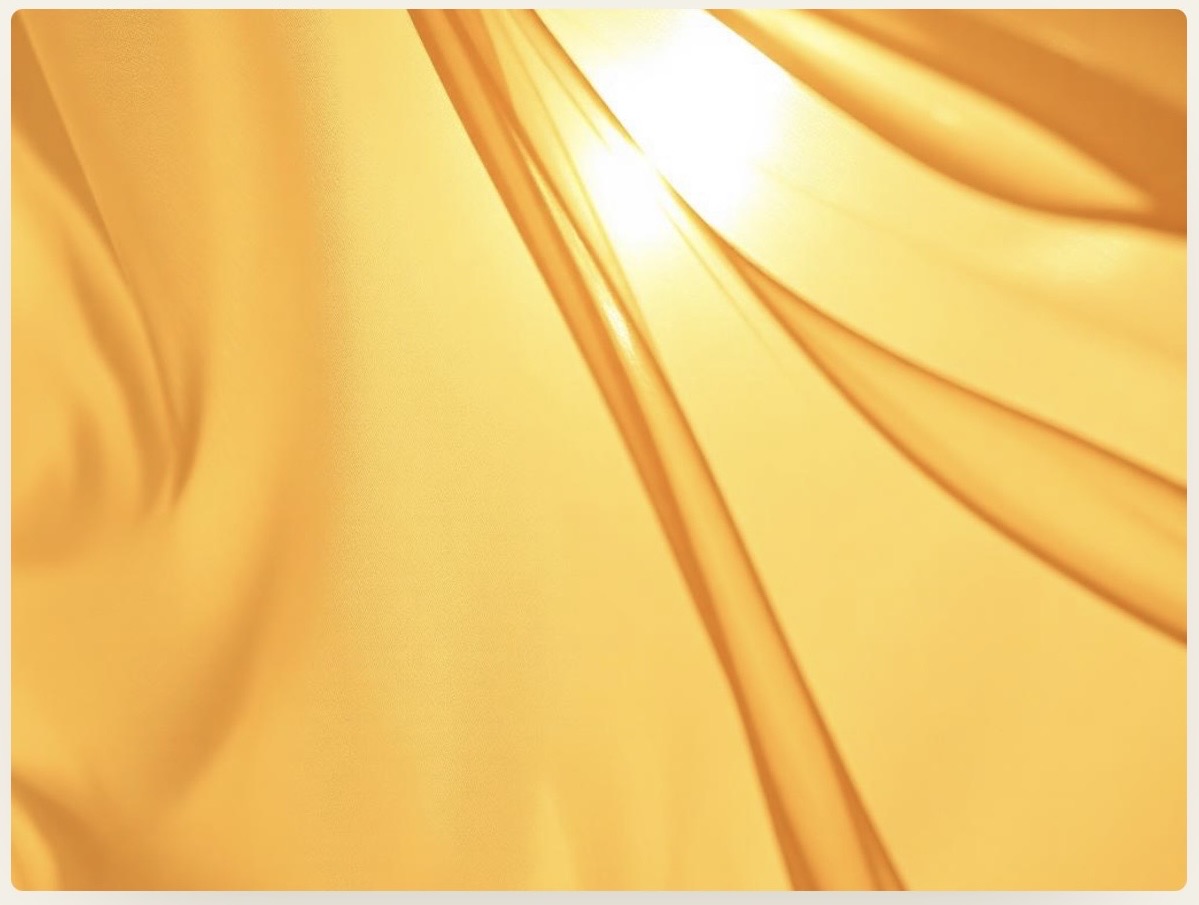 Sunlight streaming through folds of luminous golden fabric — the quiet, layered voice of intuition.